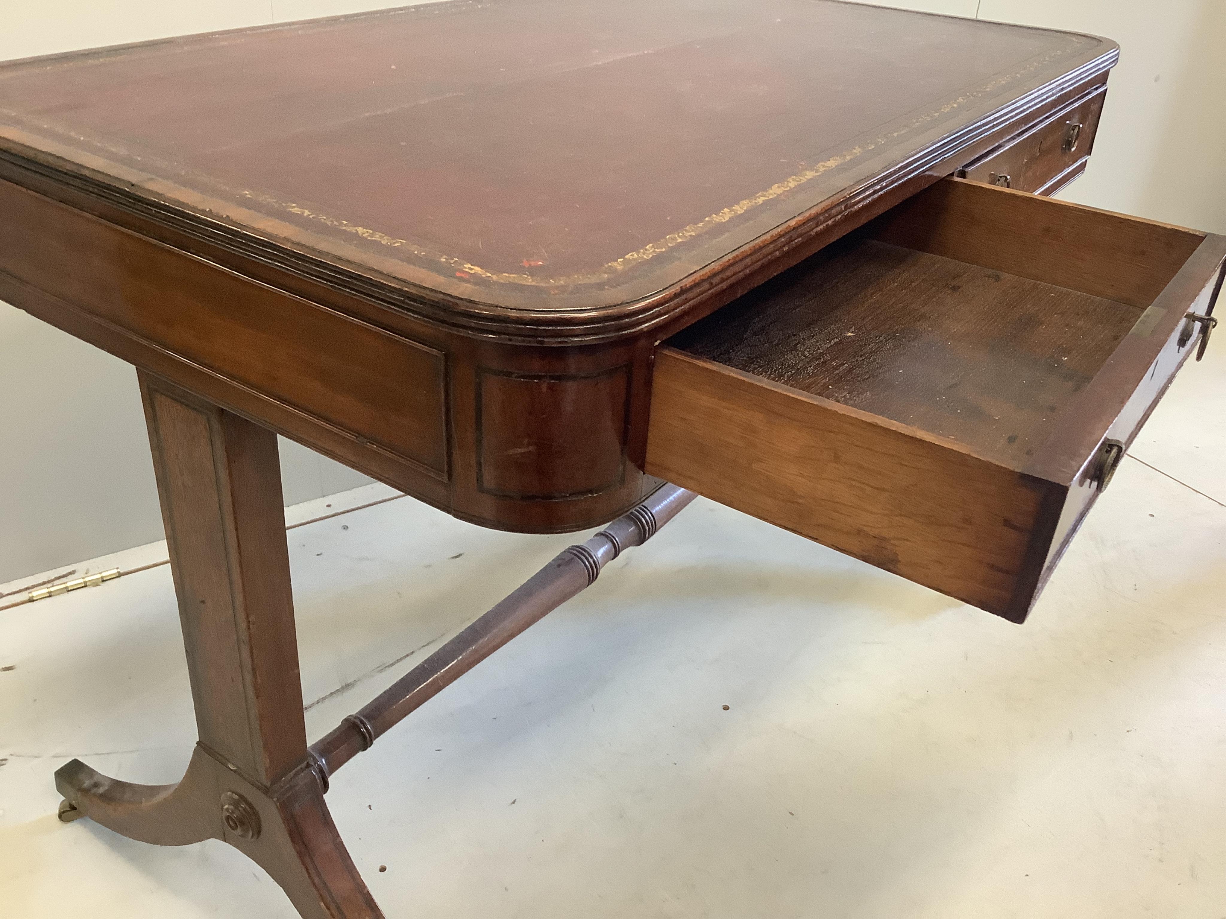 A George IV mahogany two drawer writing table, width 101cm, depth 61cm, height 73cm. Condition - fair